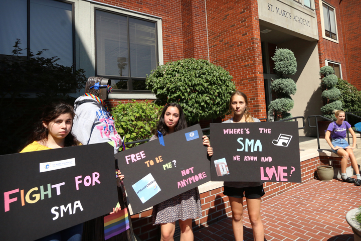 Students from St. Mary Academy in Portland, Ore., protest in front of their school Aug. 26 after learning that school officials had withdrawn a job offer to a counselor who announced plans to enter a same-sex marriage. Later that night, the school's board of directors reversed course and said the school would welcome people in same gender marriages for employment. (CNS/Ed Langlois, Catholic Sentinel)