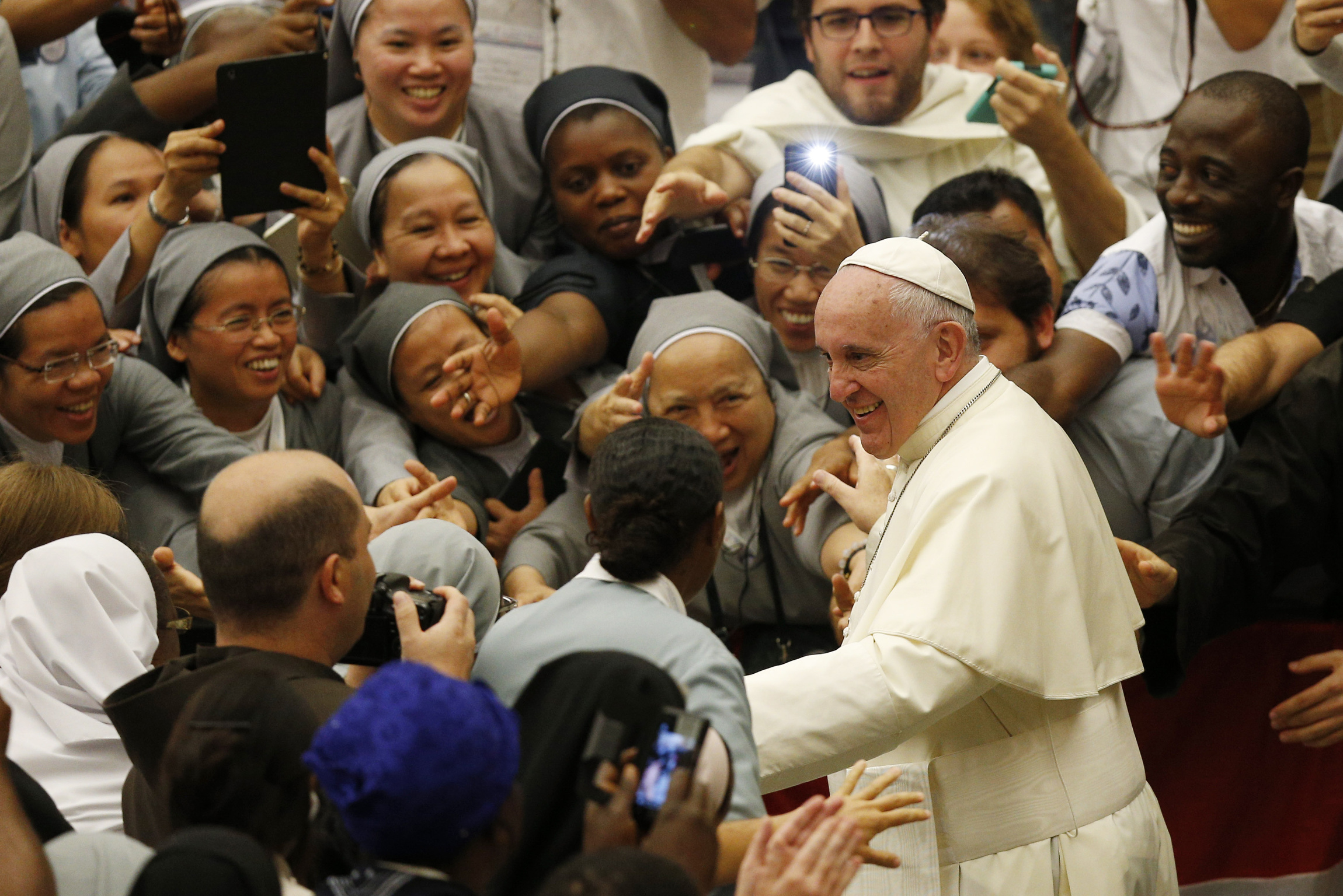 Pope Francis leaves an audience with religious from around the world in Paul VI hall at the Vatican Sept. 17. (CNS/Paul Haring)