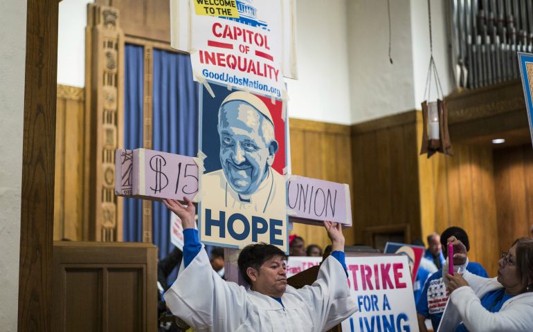 Contract workers from the U.S. Capitol and other federal buildings rally at the Lutheran Church of the Reformation during a strike over wages in Washington in September 2015. (CNS photo/Joshua Roberts)
