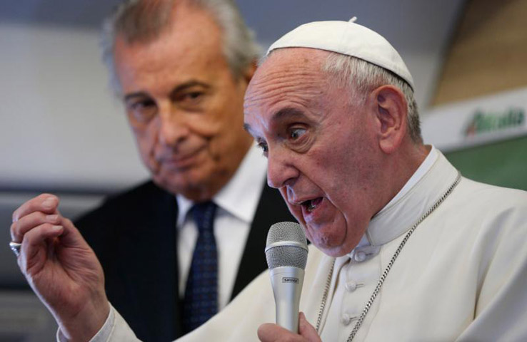 Pope Francis speaks to media aboard his flight from Cuba to the United States Sept. 22. (CNS/Paul Haring)