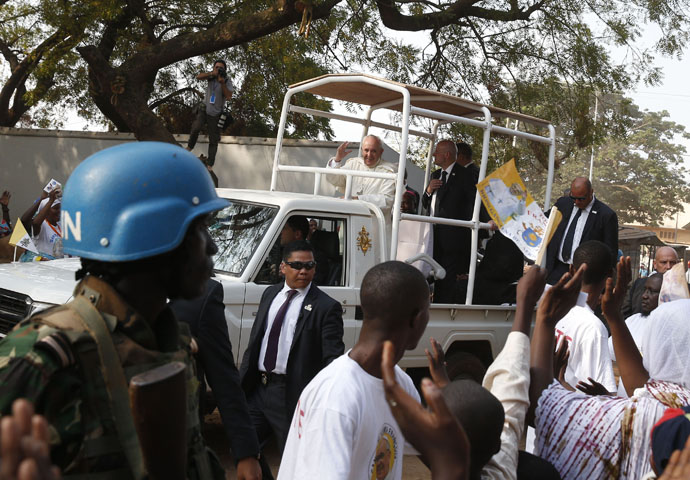 A U.N. peacekeeper stands guard as Pope Francis arrives for a meeting with the Muslim community at the Koudoukou mosque in Bangui, Central African Republic, Nov. 30, 2015. (CNS/Paul Haring)