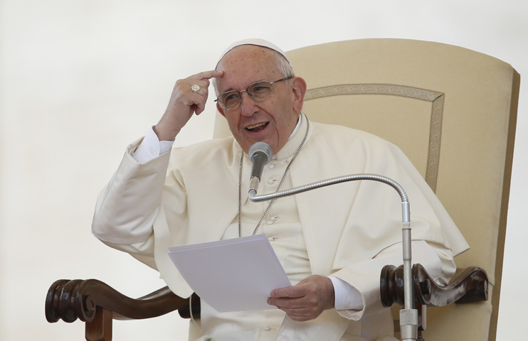 Pope Francis speaks as he leads his general audience in St. Peter's Square at the Vatican April 27. (CNS/Paul Haring)