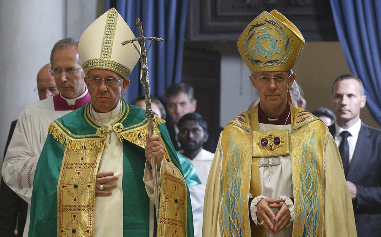 Pope Francis and Anglican Archbishop Justin Welby of Canterbury, England, at the Church of St. Gregory in Rome Oct. 5. (CNS/Paul Haring)