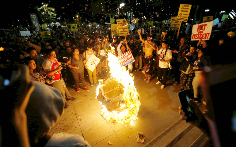 A Donald Trump pinata is burned during an election protest in Los Angeles Nov. 9. (CNS/Mario Anzuoni, Reuters)