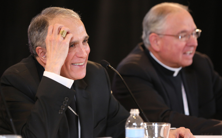 Cardinal Daniel DiNardo of Galveston-Houston addresses a news conference Nov. 15 at the fall general assembly of the U.S. Conference of Catholic Bishops in Baltimore. The cardinal was elected USCCB president that morning. Seated to his left is Archbishop Jose Gomez of Los Angeles, who was elected USCCB vice president. (CNS / Bob Roller)