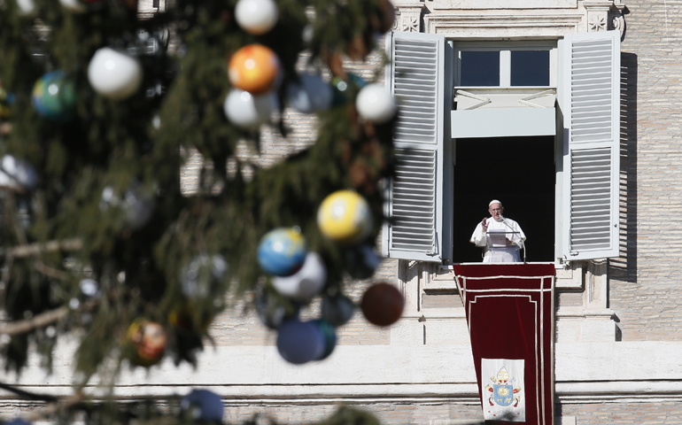Pope Francis leads the Angelus from his studio overlooking St. Peter's Square Jan. 6 at the Vatican, the feast of the Epiphany. (CNS/Paul Haring)