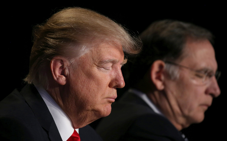 President Donald Trump prays during the National Prayer Breakfast Feb. 2 in Washington. (CNS/Carlos Barria, Reuters)