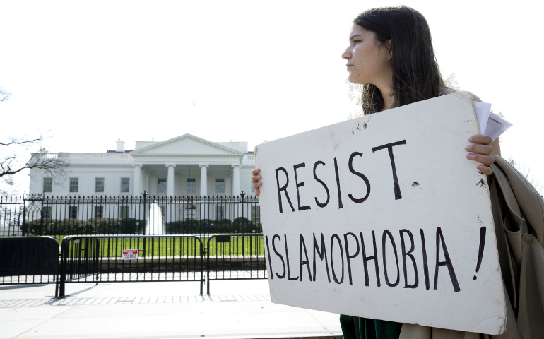 A peace activist attends an Ash Wednesday prayer service outside the White House in Washington March 1.