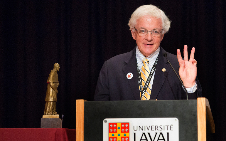 Matthew Schiller, outgoing president of the Catholic Press Association and the business and advertising manager at Catholic New York, accepts the St. Francis de Sales Award June 23 during the 2017 Catholic Media Conference in Quebec City. Schiller holds up three fingers to illustrate how many times he had been nominated for the award, the highest honor given by the CPA. (CNS/Chaz Muth)