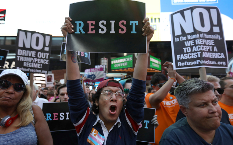 People in New York City protest U.S. President Donald Trump's announcement July 26 that he is reinstating a ban on transgender individuals serving in any capacity in the U.S. military. (CNS/Carlo Allegri, Reuters)