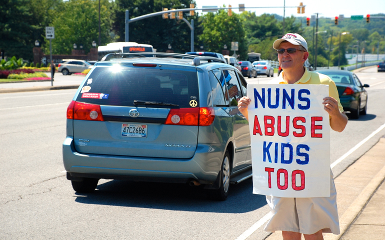 Former priest Bob Hoatson, now president of Road to Recovery in Livingston, N.J., protests Thursday across the street from where the Leadership Conference of Women Religious is meeting in Nashville, Tenn., saying the LCWR must confront sex abuse by women religious. (Dan Stockman)