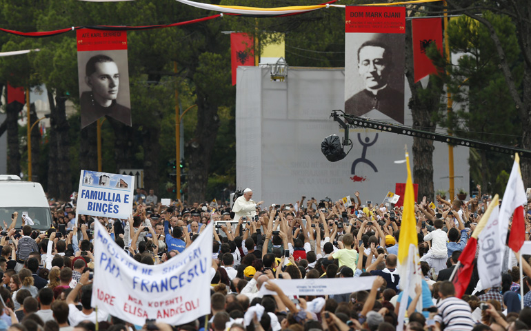 Banners depict Albanian martyrs, most of whom died under communism, as Pope Francis arrives Sunday to celebrate Mass in Mother Teresa Square in Tirana, Albania. (CNS/Paul Haring)