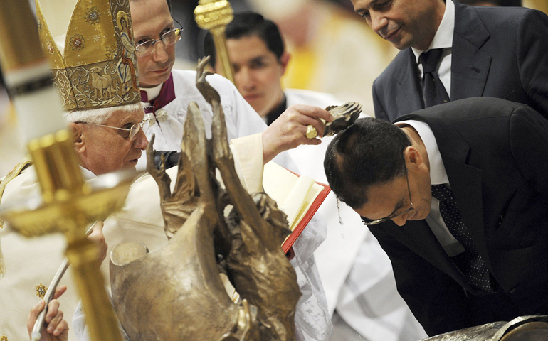 Pope Benedict XVI baptizes Magdi Allam as he celebrates the 2008 Easter Vigil in St. Peter's Basilica at the Vatican. (CNS/Reuters/Dario Pignatelli)