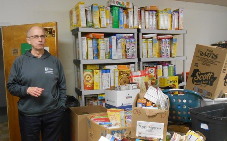 Joe Maccolini, executive director of the Patrician Society, in the Patrician Society's food pantry (Mercedes Gallese)