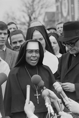 Sr. Antona Ebo delivers a statement after police halted a march to the country courthouse in Selma March 10, 1965, (AP Images/©Bettmann Corbis)