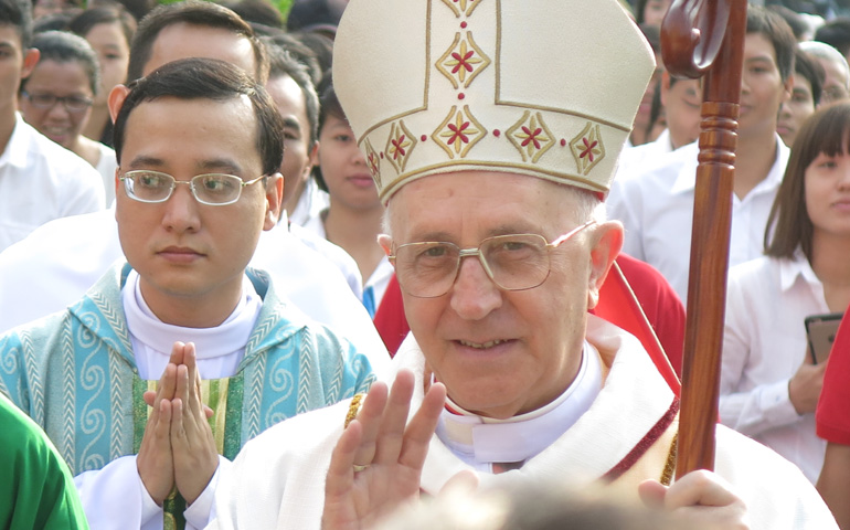 Cardinal Fernando Filoni blesses Catholics welcoming him outside the Notre Dame Cathedral in Vietnam on Jan 25. (Joachim Pham)