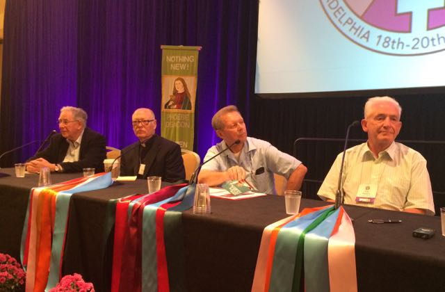 Paul Collins, Jack McClure, Roy Bourgeois and Tony Flannery during WOW panel discussion. (NCR photo/Tom Fox)