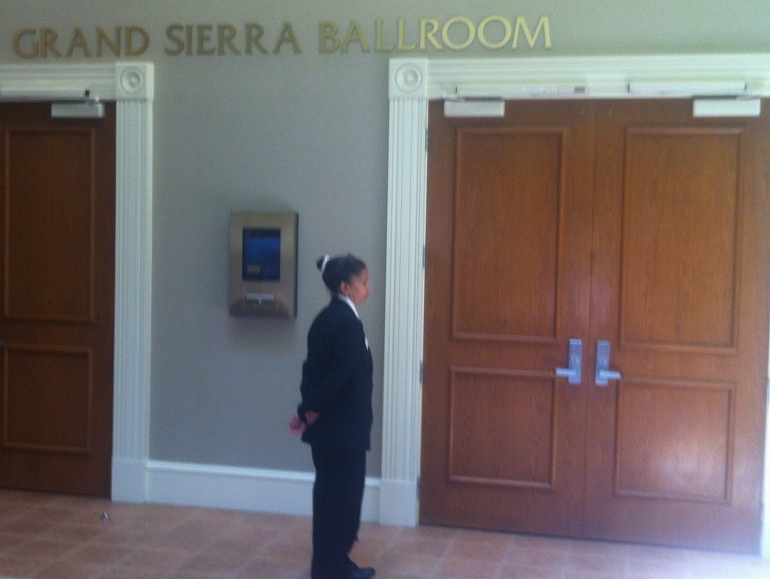 A guard prevents access to Seattle Archbishop J. Peter Sartain's address to the Leadership Conference of Women Religious in Orlando Aug. 15. (NCR photo/ Thomas C. Fox)