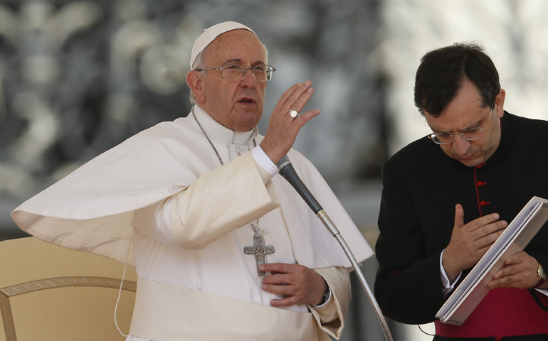 Pope Francis delivers a blessing during his general audience Wednesday in St. Peter's Square at the Vatican. (CNS/Paul Haring)