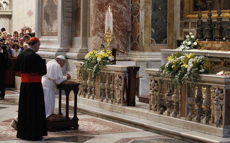 Pope Francis prays at the tomb of Blessed John XXII in St. Peter's Basilica at the Vatican on Monday, the 50th anniversary of his death. (CNS/Paul Haring)