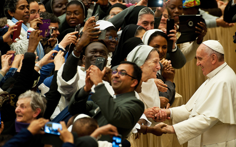 Pope Francis greets nuns and priests Saturday during a meeting with participants in an international congress organized by the Congregation for Institutes of Consecrated Life and Societies of Apostolic Life in Paul VI hall at the Vatican. (CNS/Catholic Press Photo/Massimiliano Migliorato)