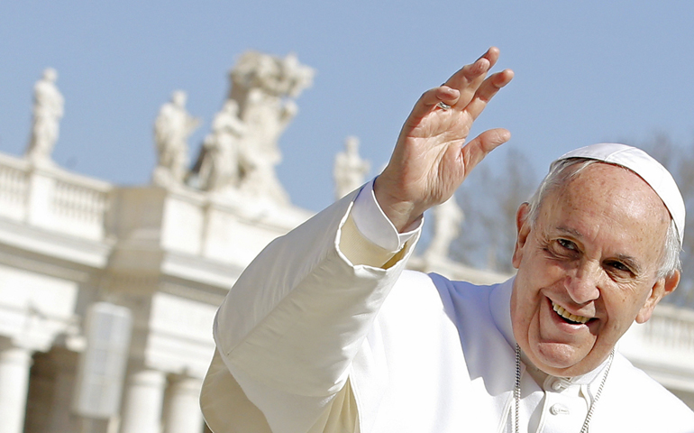 Pope Francis waves as he leads the Feb. 18 weekly audience in St. Peter's Square at the Vatican. (CNS/Reuters/Giampiero Sposito)