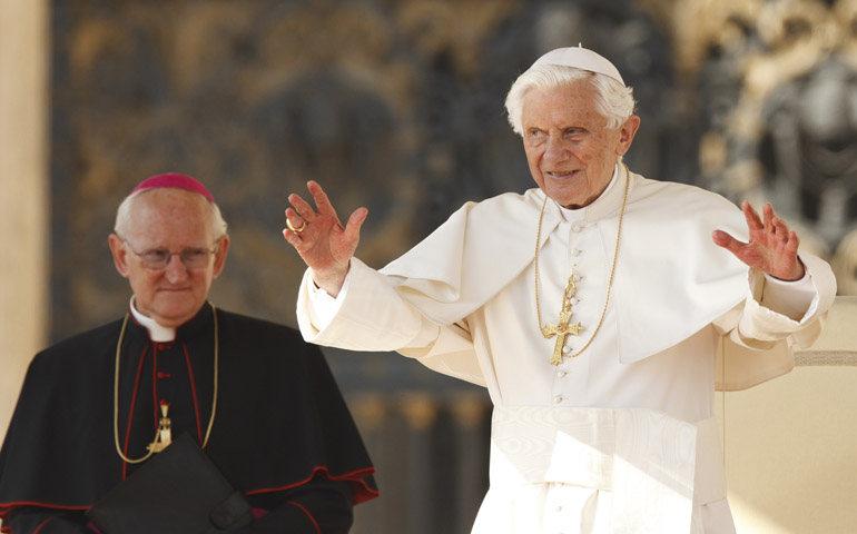 U.S. Archbishop James M. Harvey, prefect of the Papal Household, looks on as Pope Benedict XVI begins his general audience Wednesday in St. Peter's Square at the Vatican. (CNS/Paul Haring)