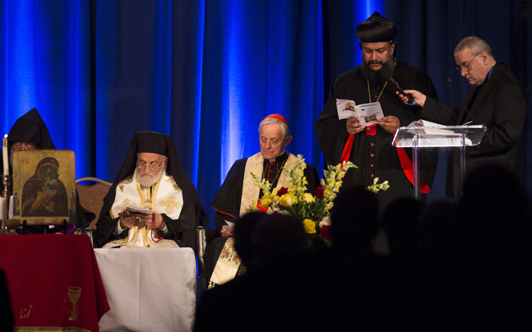 Archbishop Titus Yeldho of the Syriac Orthodox Church in North America leads a prayer during an prayer service Tuesday at the Omni Shoreham Hotel in Washington. (CNS/Tyler Orsburn)