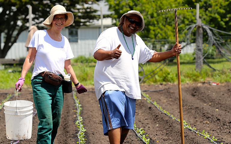 Abundant Grace Coastside Worker volunteer Karen and agricultural worker Don plant cabbage and cauliflower at Potrero Nuevo Farm. (Photo courtesy Abundant Grace)