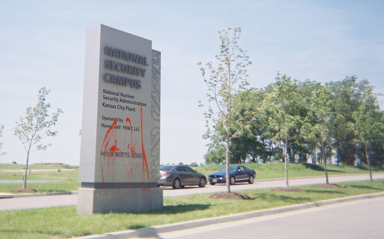 Fr. Carl Kabat splashed red paint on the entrance sign to the Kansas City, Mo., National Security Campus.