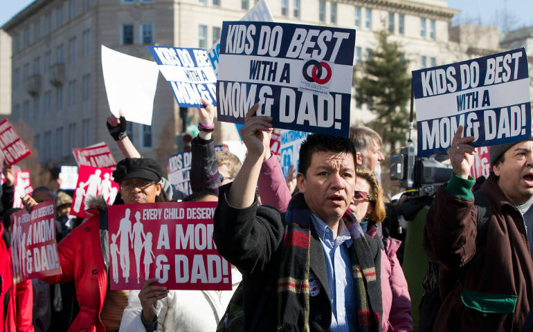 People take part in the 2013 March for Marriage outside the Supreme Court in Washington. (CNS/Nancy Phelan Wiechec)