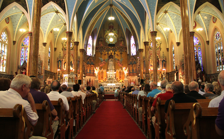 More than 2,000 people attend Mass at historic St. Albertus Church on Aug. 10 in Detroit. The Mass was organized as part of a "Mass mob" movement to fill historic inner-city Detroit churches for Masses. St. Albertus is no longer an active parish but the church remains open as a center for Polish heritage. (CNS/Detroit archdiocese/Jonathan Francis)