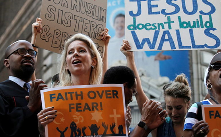 Interfaith religious leaders protest against Republican presidential candidate Donald Trump outside a hotel where he was to meet with evangelical leaders in New York on June 21, 2016. (Reuters/Brendan McDermid)