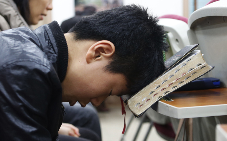 North Korean defectors living in Seoul, South Korea, pray for peace and reunification of the divided Korean Peninsula during an April 7, 2013, church service in Seoul. (CNS/Reuters/Lee Jae-Won)