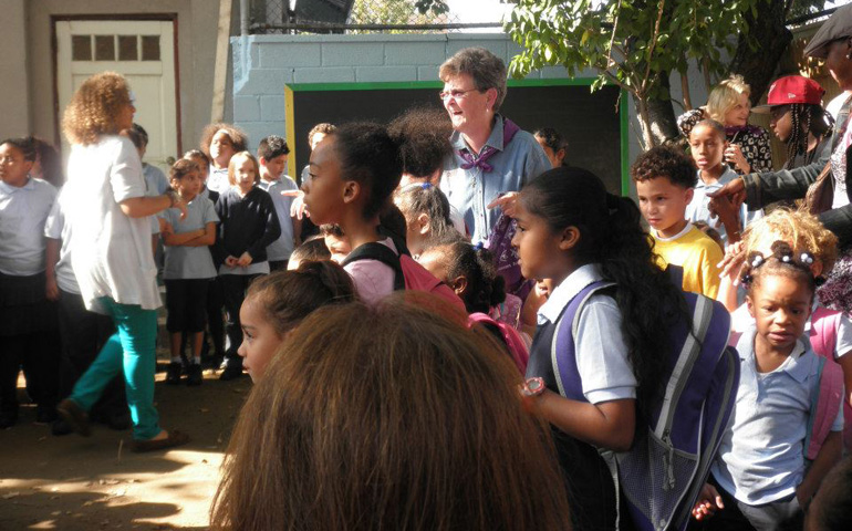 St. Joseph Sr. Tesa Fitzgerald with children from the after-school program at Hour Children (Photos courtesy of Hour Children)