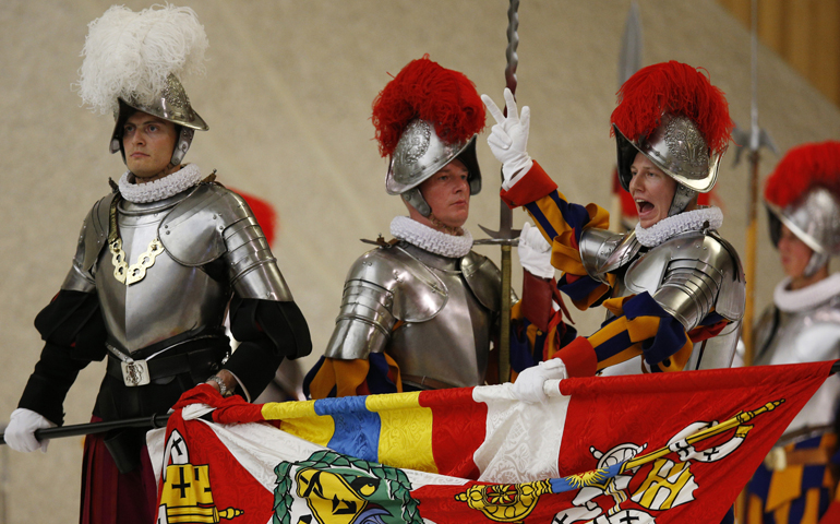 A Swiss Guard recruit takes his oath during the swearing-in ceremony for 35 recruits May 6 in Paul VI hall at the Vatican. (CNS/Paul Haring)