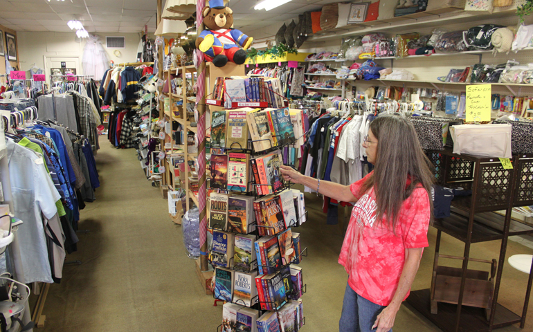 Gloria Holbrook of Verdigre, Neb., browses at the Verdigre Carousel Thrift Shop in early September. (CNS/The Catholic Voice/Deacon Keith Pavlik)