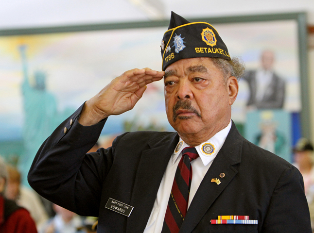 U.S. Army and Korean War veteran Carlton Edwards, 83, salutes during a ceremony held Friday in observance of Veterans Day at the Long Island State Veterans Home in Stony Brook, N.Y. (CNS/Gregory A. Shemitz)