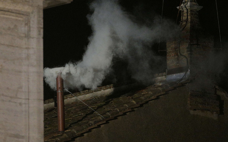 White smoke rises from the chimney above the Sistine Chapel in the Vatican on Wednesday, indicating a new pope has been elected. (CNS/Reuters/Max Rossi)