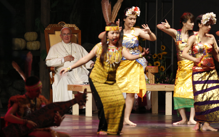 Pope Francis watches as dancers perform during a meeting Friday with Asian youth at the Sanctuary of Solmoe in South Korea. (CNS/Paul Haring) 