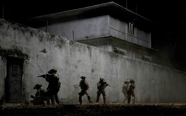 U.S. Navy SEALs are portrayed in a scene from the movie "Zero Dark Thirty." (CNS/Sony)