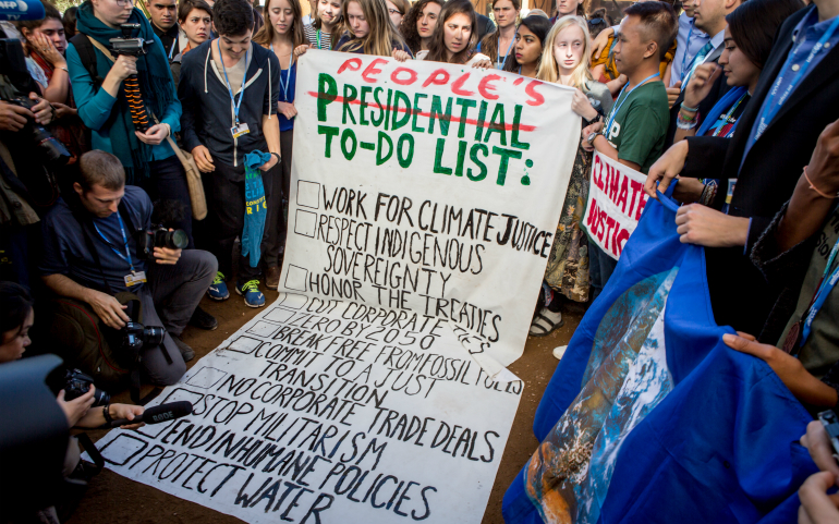 Youth at COP22, the United Nations' climate summit, in Marrakech, Morocco, protest the election of Donald Trump as the next U.S. president Nov. 9, 2016. (Photo courtesy of SustainUS)