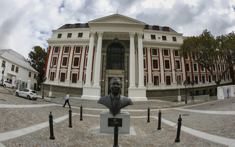 A statue of Nelson Mandela is seen in early April outside the South African Parliament building in Cape Town. (CNS photo/Nic Bothma, EPA) 