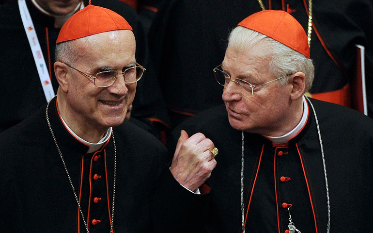 Cardinal Tarcisio Bertone, Vatican secretary of state, is seen with Cardinal Angelo Scola of Milan at the La Scala opera house during a concert attended by Pope Benedict XVI in Milan last June. (CNS/Reuters)