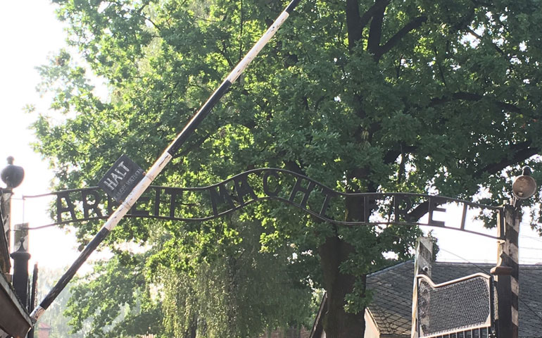 A replica of the infamous sign in German, translating to "Work sets you free," that greeted the prisoners of Auschwitz I as they entered the camp. At Auschwitz, 1.1 million people, mostly Jews, were murdered. The site now serves as a museum, memorial and a reminder. (NCR photos/Kristen Whitney Daniels)