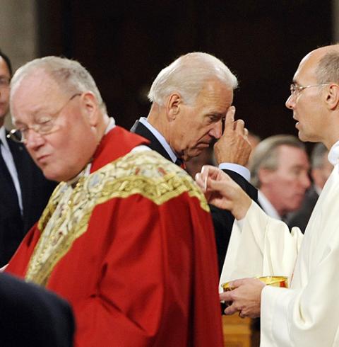 Then-Vice President Joe Biden makes the sign of the cross after receiving Communion during a Mass in 2011 at the Basilica of the National Shrine of the Immaculate Conception in Washington. (CNS/Leslie E. Kossoff) Then-Vice President Joe Biden makes the sign of the cross after receiving Communion during a Mass in 2011 at the Basilica of the National Shrine of the Immaculate Conception in Washington. (CNS/Leslie E. Kossoff)