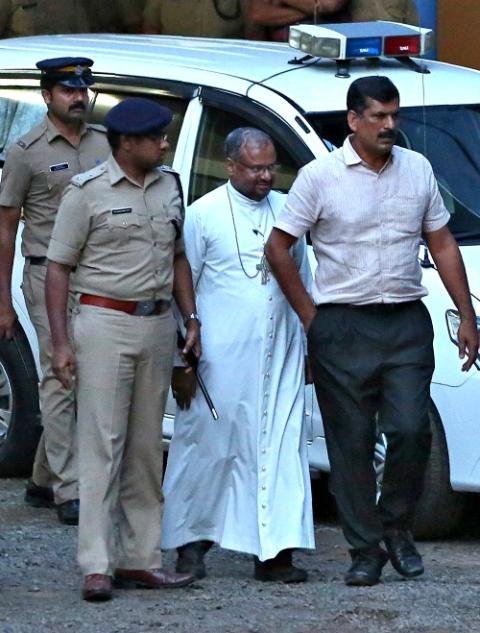 Bishop Franco Mulakkal of Jalandhar, India, is led away for questioning by police Sept. 19, 2018. (CNS/Reuters/Sivaram V)