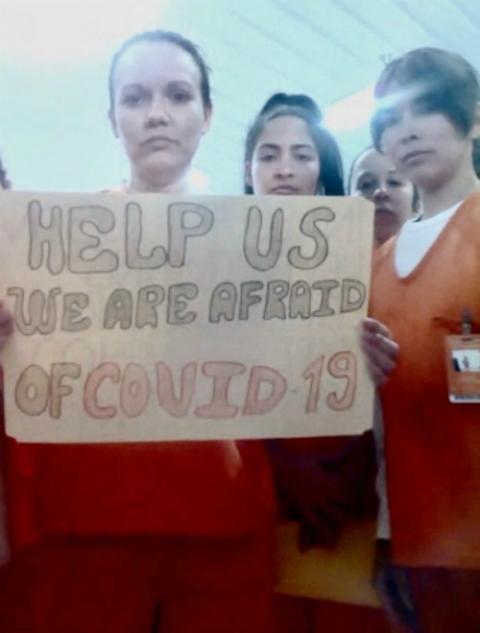 Migrants detained in an Immigration and Customs Enforcement facility in Basile, Louisiana, display signs April 3 related to the coronavirus disease. (CNS/Handout via Reuters) Migrants detained in an Immigration and Customs Enforcement facility in Basile, Louisiana, display signs April 3 related to the coronavirus disease. (CNS/Handout via Reuters)