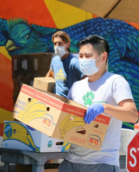 Workers at St. Margaret's Center in Lennox, California, carry boxes of food to people's cars April 15. The Catholic Charities center has been open on Wednesdays for food pickups by appointment. (CNS/The Angelus News/Courtesy of Pablo Kay) Workers at St. Margaret's Center in Lennox, California, carry boxes of food to people's cars April 15. The Catholic Charities center has been open on Wednesdays for food pickups by appointment. (CNS/The Angelus News/Courtesy of Pablo Kay)