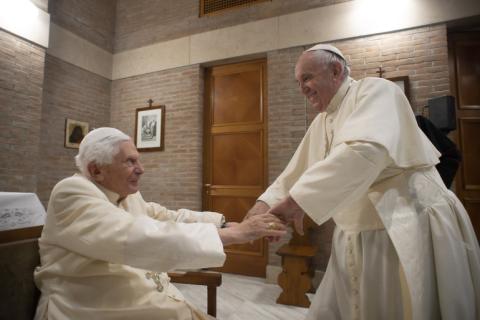 Pope Francis, right, greets retired Pope Benedict XVI at the retired pope's residence during a visit with new cardinals after a consistory at the Vatican Nov. 28, 2020. (CNS/Vatican Media)